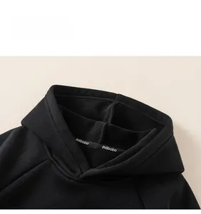 Detail of boys hoodie neckline with warm fleece lining and brand woven tape