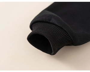 Detail shot of the ribbed elastic cuffs on this warm black winter fleece hoodie for boys