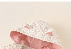 Detail of floral quilted jacket for girls featuring hood with cute 3D animal ears