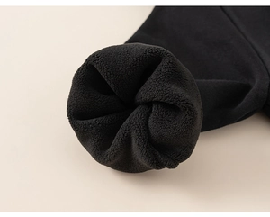 Detail shot of black boys hoodie showing soft high-density fleece lining for warmth