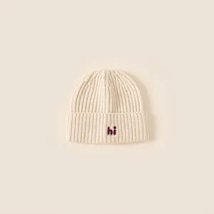 Off-white knitted baby beanie with red hi embroidery for outdoor windproof warmth