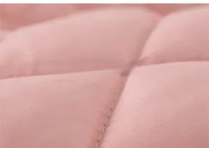Close-up of pink quilted fabric with elegant diamond stitching on kid's winter coat