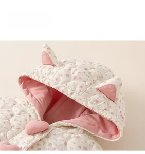 Detail of floral hooded toddler jacket with heart button and cute cat ear decoration