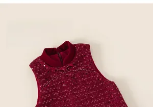 Detail of burgundy sequined dress with velvet collar and traditional Chinese knots