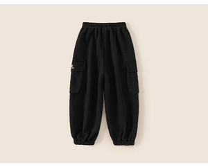 Detail of black kids jogger pants with elastic waist and bear embroidery on the pocket