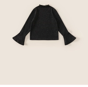Detail of black girl's knit sweater featuring ruffle collar and flared cuffs with silver glitter