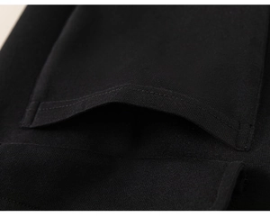Detail showing the premium stitching and soft thick knit fabric on black joggers