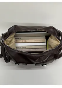 Top view showing large capacity and internal storage of the dark brown leather tote bag
