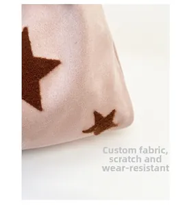 Macro shot of custom pink suede fabric with star embroidery and scratch-resistant texture