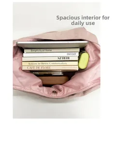 Detail of spacious pink plush tote bag interior with magnetic clasp and satin lining