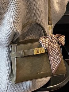 Chic olive green faux leather handbag with silk scarf handle and golden twist lock clasp