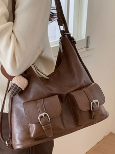 Deep brown vintage PU leather tote bag with dual cargo pockets and plush charm on shoulder