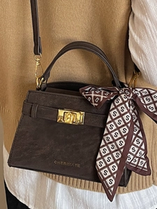 Retro dark brown crossbody handbag with frosted leather finish and silk scarf detail