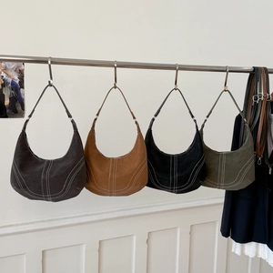 Retro hobo shoulder bags with contrast stitching in four colors shown hanging together