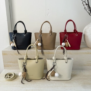 Litchi texture leather bucket bags in multiple colors with baseball themed charms