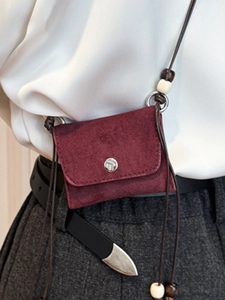 Vintage burgundy mini crossbody bag with suede texture and decorative wooden beads