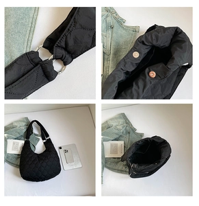 Détails du sac matelassé noir avec anneau en métal argenté et fermeture magnétique