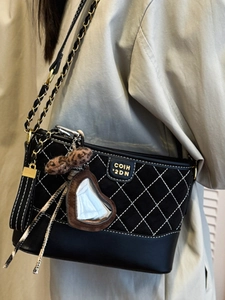 Quilted black hobo bag with gold chain strap and leopard bow charm for women
