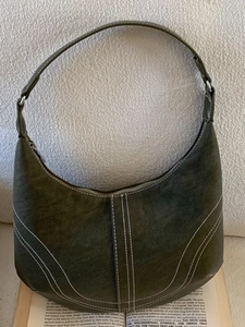 Retro olive green half-moon underarm bag with contrast stitching and adjustable strap