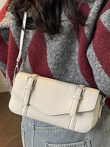 Minimalist beige pebble leather square shoulder bag with chic V-cut flap and dual buckles