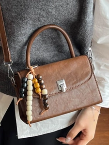 Retro brown crossbody handbag for women with beaded charm and silver buckle closure