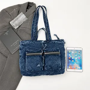 Deep blue denim tote bag size comparison with an iPad and lifestyle essentials