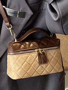 Quilted two-tone crossbody bag with gold zippers and adjustable strap for women