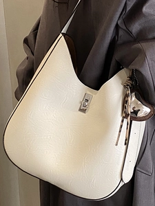 Large beige leather hobo bag for women with leopard print ribbon and silver clasp