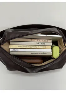 Spacious interior of large brown tote bag showing storage capacity for daily essentials