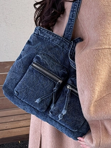 Deep blue washed denim tote bag with front zip pockets for casual autumn winter wear