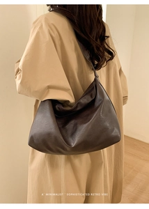 Minimalist soft dark brown leather hobo bag with wide shoulder strap in retro style