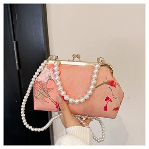 Pink silk evening bag with floral bird embroidery and large pearl bead handle strap