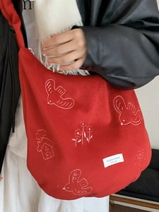 Artistic red canvas tote bag with white embroidery patterns for women's daily commute