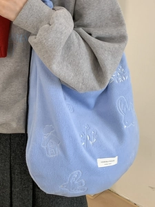 Light blue fuzzy tote bag with embroidery and adjustable shoulder strap for daily casual use