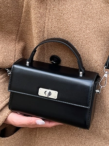 Classic black leather square handbag with silver metal twist lock and top handle