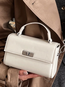 Elegant white square handbag with silver metal lock for women in minimalist modern style