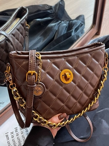 Brown quilted crossbody bag with gold chain strap and metallic clasp closure for women