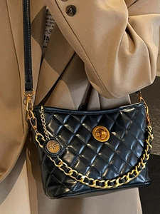 Black quilted leather shoulder bag with gold chain strap and vintage twist lock design