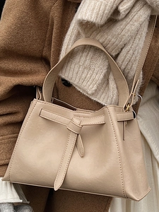 Retro beige leather bucket bag with knot detail and shoulder strap for women