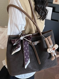 Classic dark brown tote bag for women with floral scarf and cute rabbit charm detail
