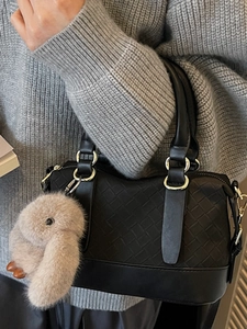 Classic black woven crossbody pillow bag with cute plush bunny charm for daily commuting