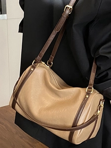 Vintage khaki Boston bag for women with brown trim and adjustable gold hardware strap