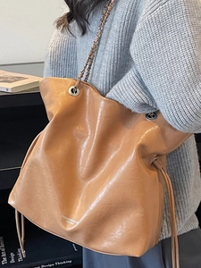 Large vintage brown leather chain tote bag for women with pleated design for daily commuting