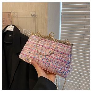 Pink sequin evening bag featuring a round rhinestone handle and a gold metal chain