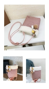 Detailed view of pink crossbody bag with white faux fur trim and cute star pendant accessory