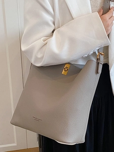 Minimalist grey litchi leather bucket bag with golden twist lock for women