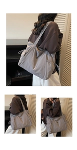 Detailed side view of large grey tote bag with functional drawstring and metal hardware