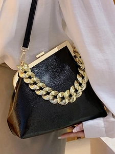 Classic black vintage leather handbag with gold chain strap and kiss-lock closure