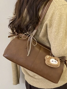 Vintage brown PU leather shoulder bag with ribbon bow and plush bear pendant detail