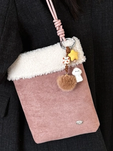 Pink faux suede crossbody bag with white shearling trim and cute plush puppy charm